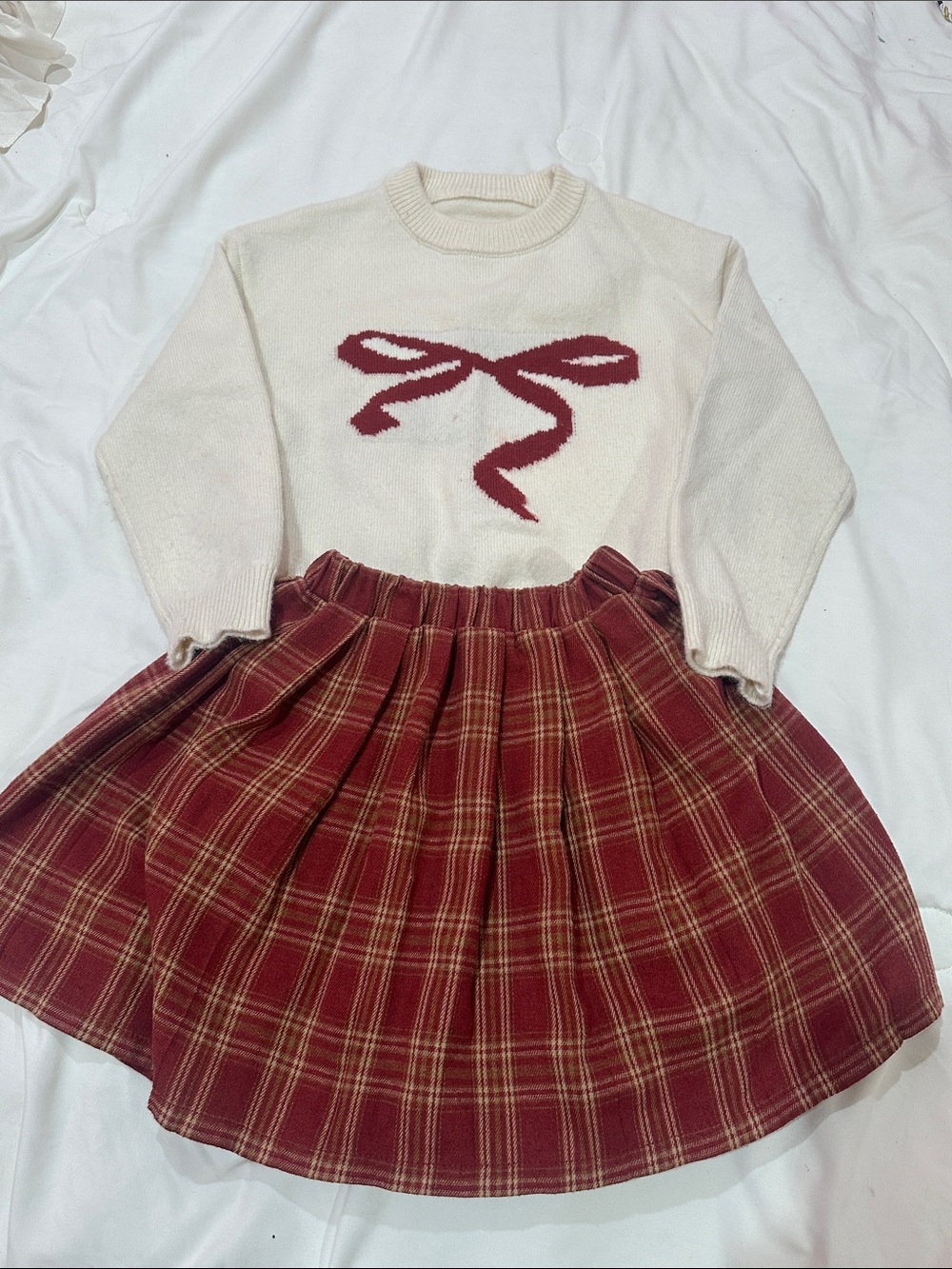 SHEIN Cream Knit Sweater with Red Bow and plaid skirt.